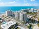 Stunning aerial view of beachfront property and ocean at 2050 Benjamin Franklin Dr # B304, Sarasota, FL 34236