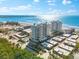 Aerial view of luxurious beachfront condo building with stunning ocean views at 2050 Benjamin Franklin Dr # B304, Sarasota, FL 34236