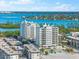 Aerial view of condo building near the beach and waterway at 2050 Benjamin Franklin Dr # B304, Sarasota, FL 34236