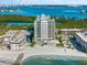 Aerial view of a condo building on the beach with water access at 2050 Benjamin Franklin Dr # B304, Sarasota, FL 34236