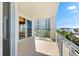 Balcony with sliding glass doors and ocean view at 2050 Benjamin Franklin Dr # B304, Sarasota, FL 34236