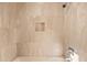 Clean bathroom with marble tile and shower niche at 2050 Benjamin Franklin Dr # B304, Sarasota, FL 34236