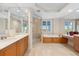 Elegant bathroom with soaking tub, walk-in shower, and double vanity at 2050 Benjamin Franklin Dr # B304, Sarasota, FL 34236