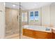 Spa-like bathroom featuring a large shower and soaking tub at 2050 Benjamin Franklin Dr # B304, Sarasota, FL 34236