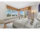 Main bedroom with a king-size bed and stunning view at 2050 Benjamin Franklin Dr # B304, Sarasota, FL 34236