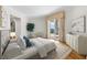 Elegant bedroom with hardwood floors and access to private balcony at 2050 Benjamin Franklin Dr # B304, Sarasota, FL 34236