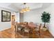 Bright dining room with hardwood floors and wood dining table set at 2050 Benjamin Franklin Dr # B304, Sarasota, FL 34236