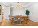 Bright dining room with hardwood floors and wood dining table set at 2050 Benjamin Franklin Dr # B304, Sarasota, FL 34236