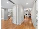 Light-filled hallway with wood floors, leading to bedrooms and living areas at 2050 Benjamin Franklin Dr # B304, Sarasota, FL 34236