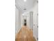 Light and bright hallway with hardwood floors at 2050 Benjamin Franklin Dr # B304, Sarasota, FL 34236