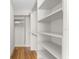 Spacious walk-in closet with ample shelving and hanging space at 2050 Benjamin Franklin Dr # B304, Sarasota, FL 34236