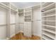 Bright walk-in closet with custom shelving and hanging space at 2050 Benjamin Franklin Dr # B304, Sarasota, FL 34236