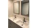 Double vanity bathroom with modern sinks and faucets at 2100 Benjamin Franklin Dr # 108, Sarasota, FL 34236