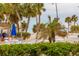 Partial view of beach, ocean, and palm trees at 2100 Benjamin Franklin Dr # 108, Sarasota, FL 34236