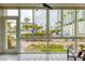 Enclosed patio with seating area and pool view at 2100 Benjamin Franklin Dr # 108, Sarasota, FL 34236