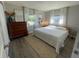 Main bedroom with wood dresser and large bed at 2510 Parma St, Sarasota, FL 34231