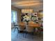 Dining area with built-in shelving and a wood table at 2510 Parma St, Sarasota, FL 34231