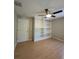 Bedroom with built-in shelving and wood flooring at 2537 Tishman Ave, North Port, FL 34286