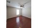 Spacious bedroom featuring wood flooring and ceiling fan at 2537 Tishman Ave, North Port, FL 34286