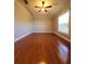 Spacious bedroom with hardwood floors and ceiling fan at 2537 Tishman Ave, North Port, FL 34286