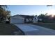 Front view showcasing the driveway and garage at 2537 Tishman Ave, North Port, FL 34286