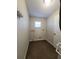 Laundry room with tile floor and storage at 2537 Tishman Ave, North Port, FL 34286