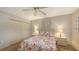 Bedroom with floral bedding and double closets at 2621 Golf Course Dr # 401, Sarasota, FL 34234