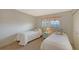 Bedroom with twin beds, nightstands, and ample closet space at 2621 Golf Course Dr # 401, Sarasota, FL 34234