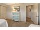 Bedroom with dresser, closet and access to another room at 2621 Golf Course Dr # 401, Sarasota, FL 34234