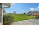 Landscaped community with lush green lawns and mature trees at 2621 Golf Course Dr # 401, Sarasota, FL 34234