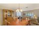 Elegant dining room features a wood table and hutch at 2621 Golf Course Dr # 401, Sarasota, FL 34234