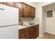 Modern kitchen with wood cabinets and granite counters at 2764 Hidden Lake Blvd # 2764, Sarasota, FL 34237