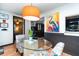 Bright dining area with glass table and colorful chairs, near the kitchen at 2885 Arrowhead Rd, Venice, FL 34293