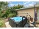 Inviting hot tub surrounded by lush landscaping at 2885 Arrowhead Rd, Venice, FL 34293