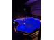 Night view of a hot tub with blue LED lights at 2885 Arrowhead Rd, Venice, FL 34293