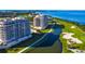 Aerial view of luxury condos near golf course and ocean at 3060 Grand Bay Blvd # 113, Longboat Key, FL 34228