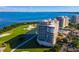 Luxury condo building with water and golf course views at 3060 Grand Bay Blvd # 113, Longboat Key, FL 34228