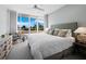 Main bedroom with king bed and balcony access at 3060 Grand Bay Blvd # 113, Longboat Key, FL 34228