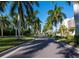 Palm tree-lined driveway leading to Grand Bay community at 3060 Grand Bay Blvd # 113, Longboat Key, FL 34228