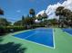 Two paddle tennis courts surrounded by lush landscaping at 3060 Grand Bay Blvd # 113, Longboat Key, FL 34228