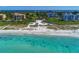 Aerial view of beachfront property with condos and clear water at 3080 Grand Bay Blvd # 544, Longboat Key, FL 34228