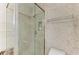 Bathroom with a shower and marble tile at 3080 Grand Bay Blvd # 544, Longboat Key, FL 34228