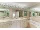 Double vanity bathroom with a large bathtub and shower at 3080 Grand Bay Blvd # 544, Longboat Key, FL 34228