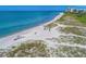 Aerial view of a calm beach with people at 3080 Grand Bay Blvd # 544, Longboat Key, FL 34228