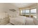 Main bedroom with ocean view and built-in dresser at 3080 Grand Bay Blvd # 544, Longboat Key, FL 34228