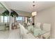 Spacious dining area with glass table and kitchen access at 3080 Grand Bay Blvd # 544, Longboat Key, FL 34228