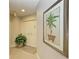 Bright condo entryway with tiled floors and a large botanical print at 3080 Grand Bay Blvd # 544, Longboat Key, FL 34228