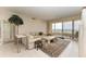 Spacious living room with floor to ceiling windows and waterfront views at 3080 Grand Bay Blvd # 544, Longboat Key, FL 34228