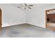 Spacious carpeted bedroom with access to another room at 3231 Yorktown St, Sarasota, FL 34231