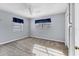 Simple bedroom with gray walls and carpeted floor at 3231 Yorktown St, Sarasota, FL 34231